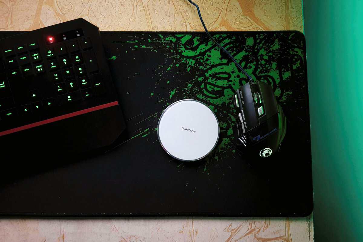 An extended best budget gaming mouse pad with green graphics, mechanical keyboard, and gaming mouse on a desk setup.