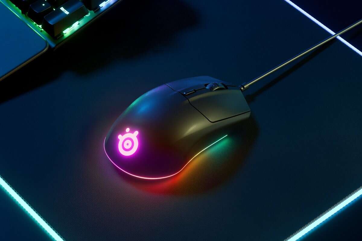 SteelSeries Rival 3 best gaming mouse under $50 with RGB lighting on a dark mousepad