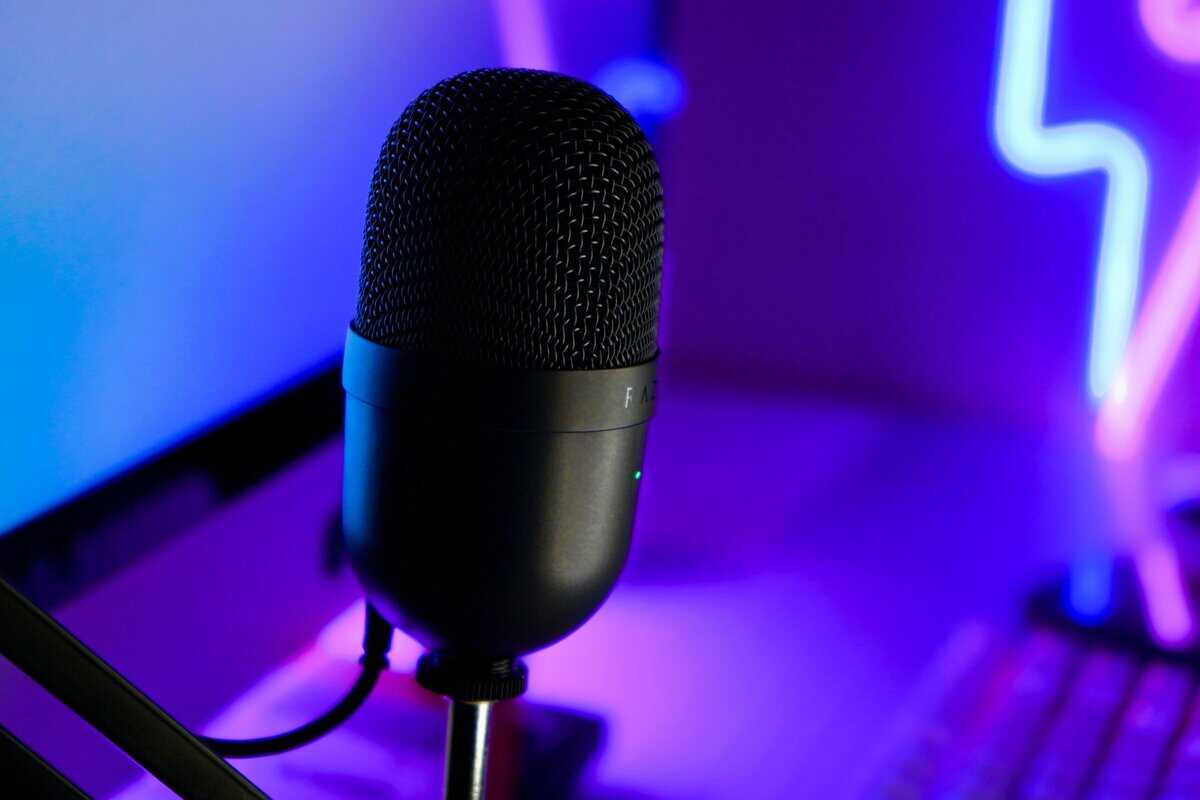The best budget USB microphone for gaming setups in front of a purple background 