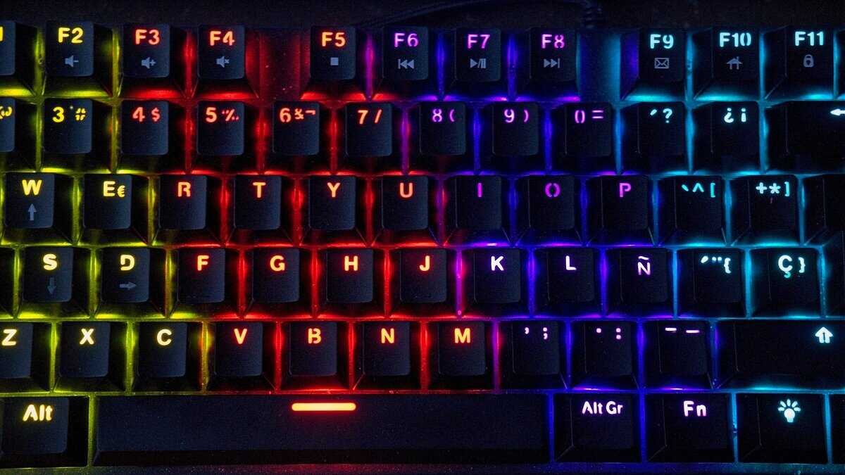 Best budget keyboard for gaming with rainbow RGB backlighting showing mechanical keycaps and function row