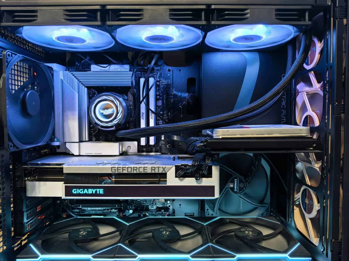 Gaming PC interior with Gigabyte GeForce RTX GPU, AIO liquid cooler, and case fans showing proper airflow setup for maintaining normal CPU temp during gaming