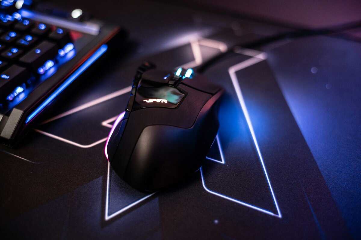 Close-up of a gaming mouse from the best gaming keyboard and mouse combo on an RGB mouse pad