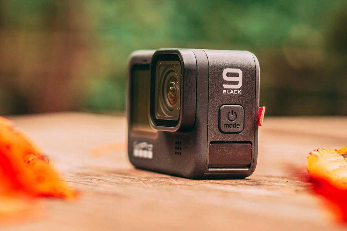 GoPro action camera on a wooden surface as a compact 4K ultra HD camera option for streaming