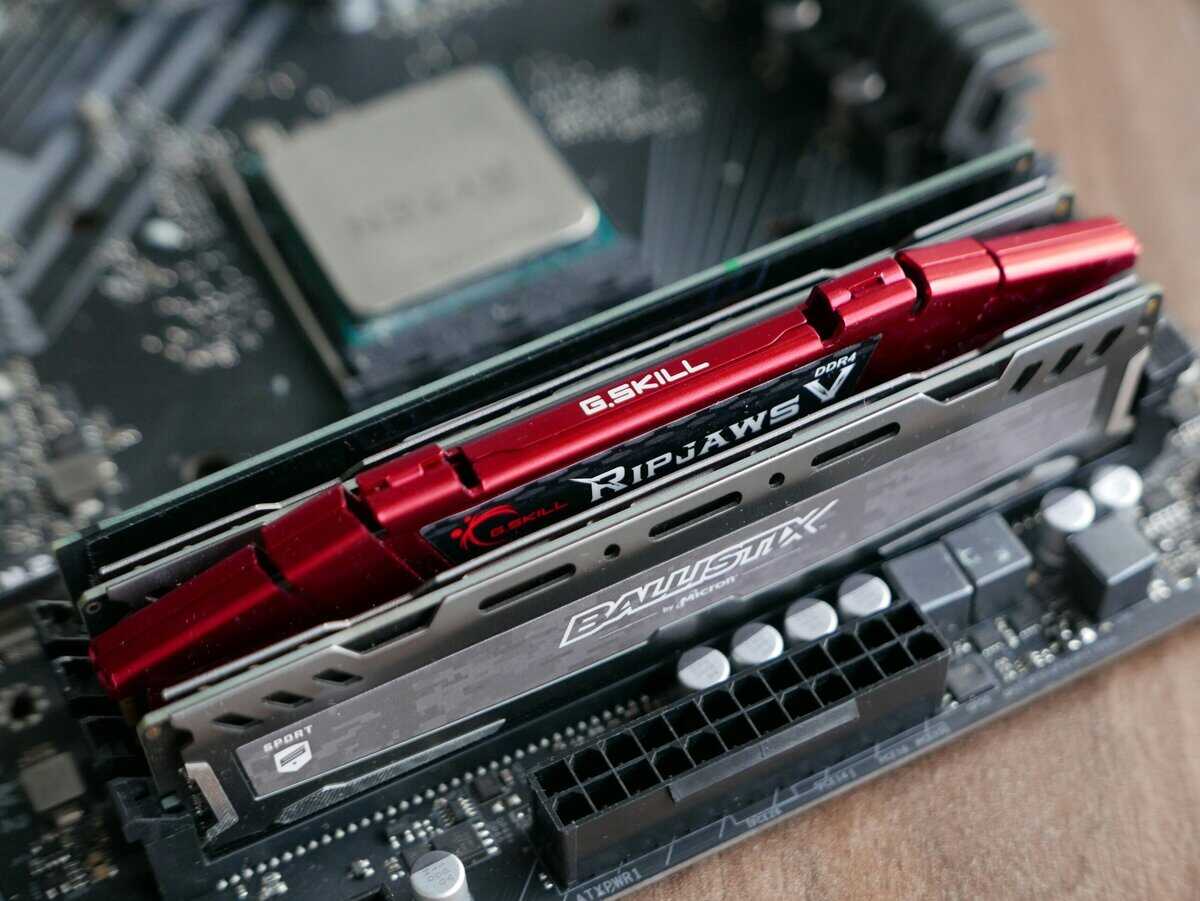 G.Skill Ripjaws V and Crucial Ballistix RAM sticks installed on a motherboard showing how much RAM for gaming a dual-channel setup provides"