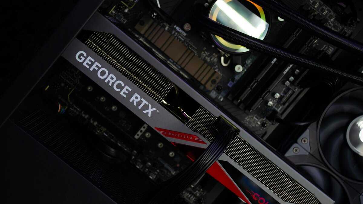 NVIDIA GeForce RTX graphics card seated in a PCIe slot alongside an AIO liquid cooler, showing how the best mid range GPU for 1080p and 1440p fits into a compact build