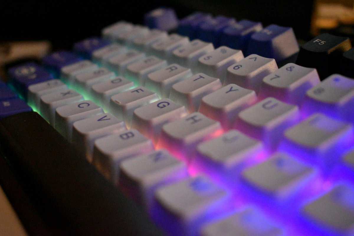 Mechanical gaming keyboard with vibrant multi-color RGB lighting across the keycaps, showcasing features found in the best budget keyboard for Apex Legends