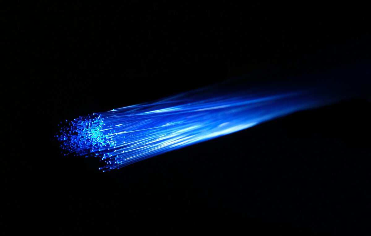 Glowing fiber optic cables, the infrastructure layer behind how to get better ping in 2026