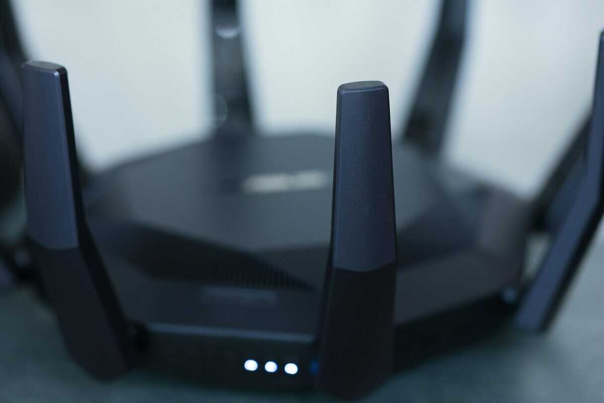 Black gaming router with multiple antennas and LED indicators, a typical design for the best gaming router in this price range