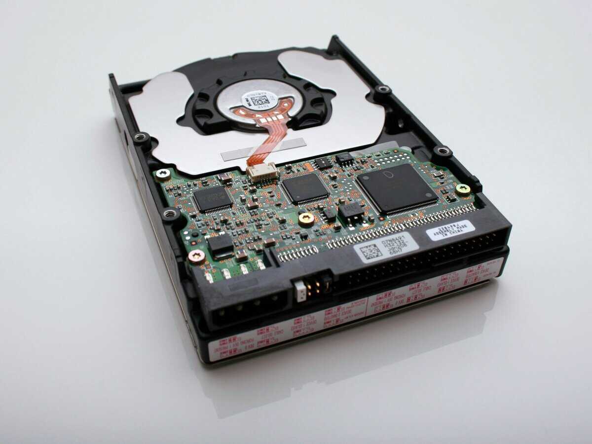 Bottom view of a 3.5-inch hard disk drive showing the circuit board and SATA connectors, representing the HDD option in ssd vs hdd for gaming