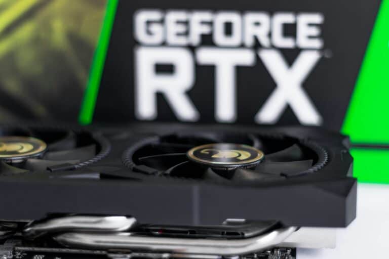 NVIDIA GeForce RTX graphics card with green branding visible, the kind of card buyers compare in the RTX 4060 vs RTX 4070 conversation