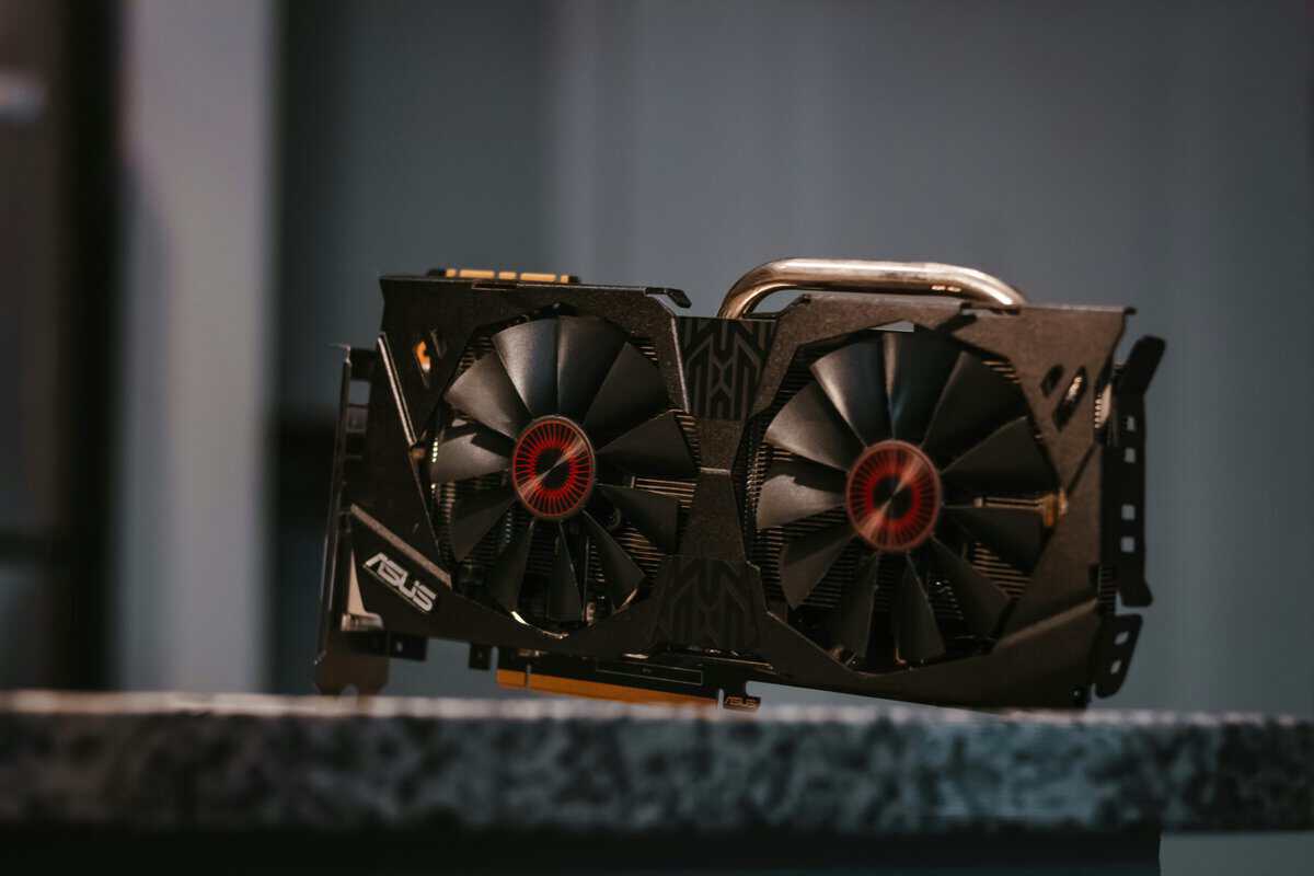 ASUS dual-fan GeForce graphics card on a counter, a typical mid-range option in the RTX 4060 vs RTX 4070 lineup