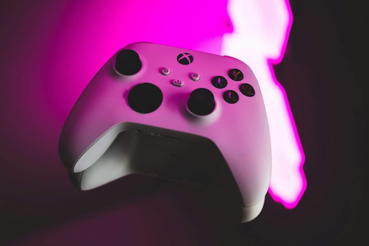 Hand gripping a wireless gaming controller, showing the ergonomics that matter for the best controller for Rocket League