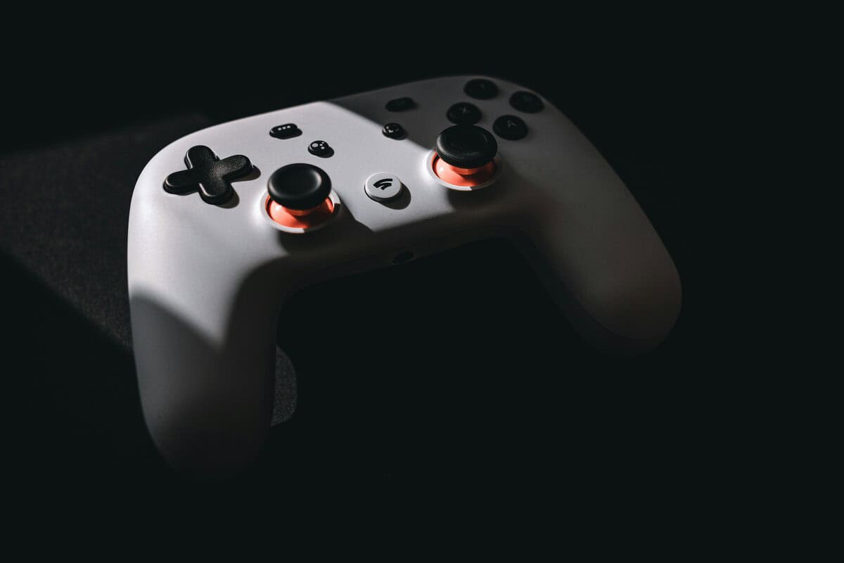 Dark gaming setup with controller — picking the best controller for Rocket League starts with feel, not features