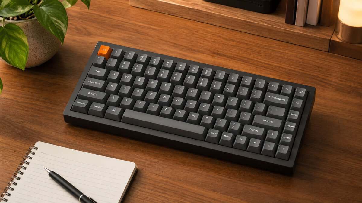 Compact black and gray 75% mechanical keyboard with an orange Esc key, a best 75% keyboard for gaming