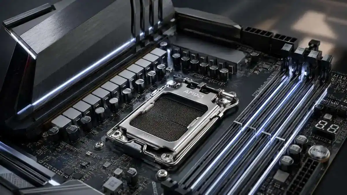 Close-up of an AMD AM5 motherboard with an empty CPU socket and white-lit VRM heatsinks, the build quality that separates the best AM5 motherboard from the rest