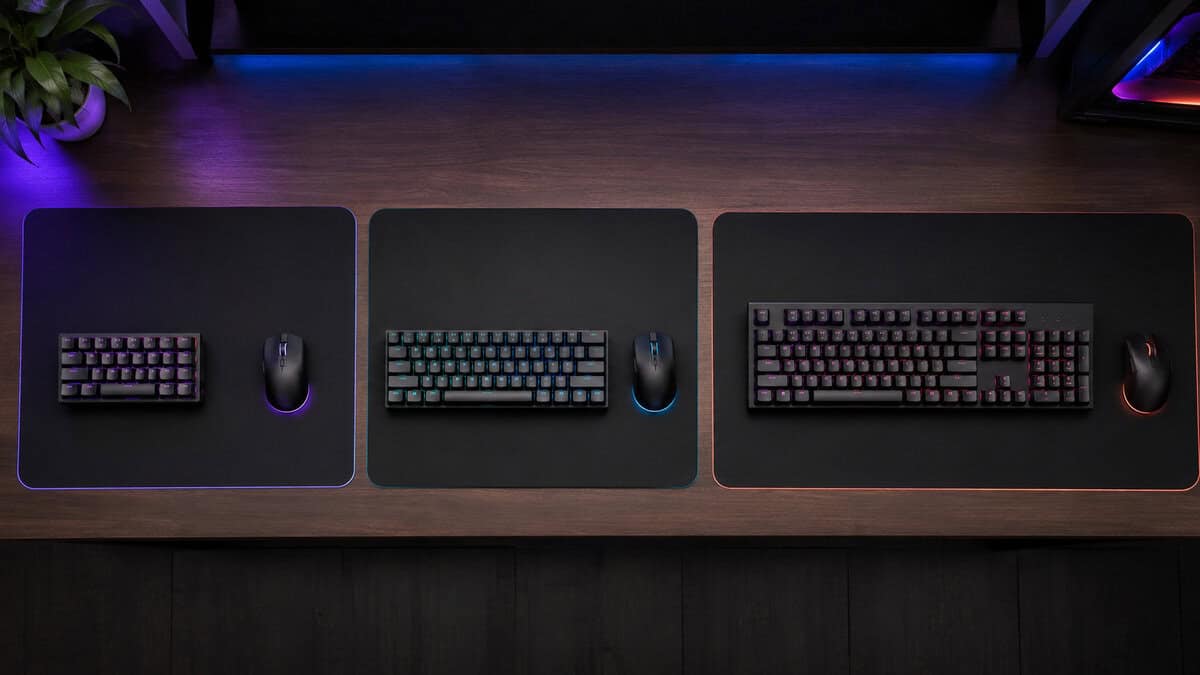 Keyboard size comparison across three desk mats, from a compact 40% keyboard up to a full-size layout