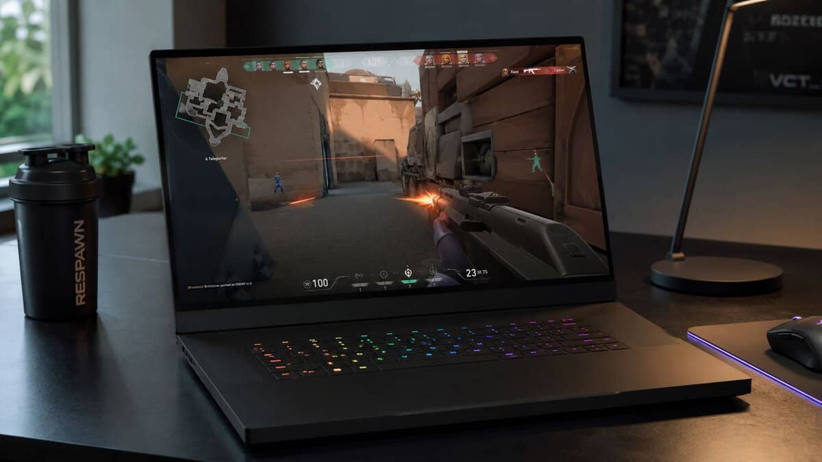 Black gaming laptop with an RGB keyboard running a Valorant match on a dark desk, the kind of esports workload the best gaming laptop under 2000 is built for.