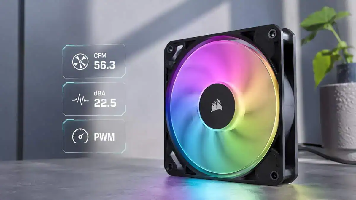 Corsair fan from our best RGB case fans picks standing on a desk with its rainbow lighting active