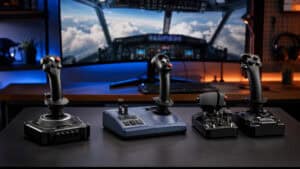 Four flight sticks and a throttle unit lined up on a dark desk, with a cockpit view above the clouds on the curved monitor behind, comparing the hardware covered in this best flight stick guide