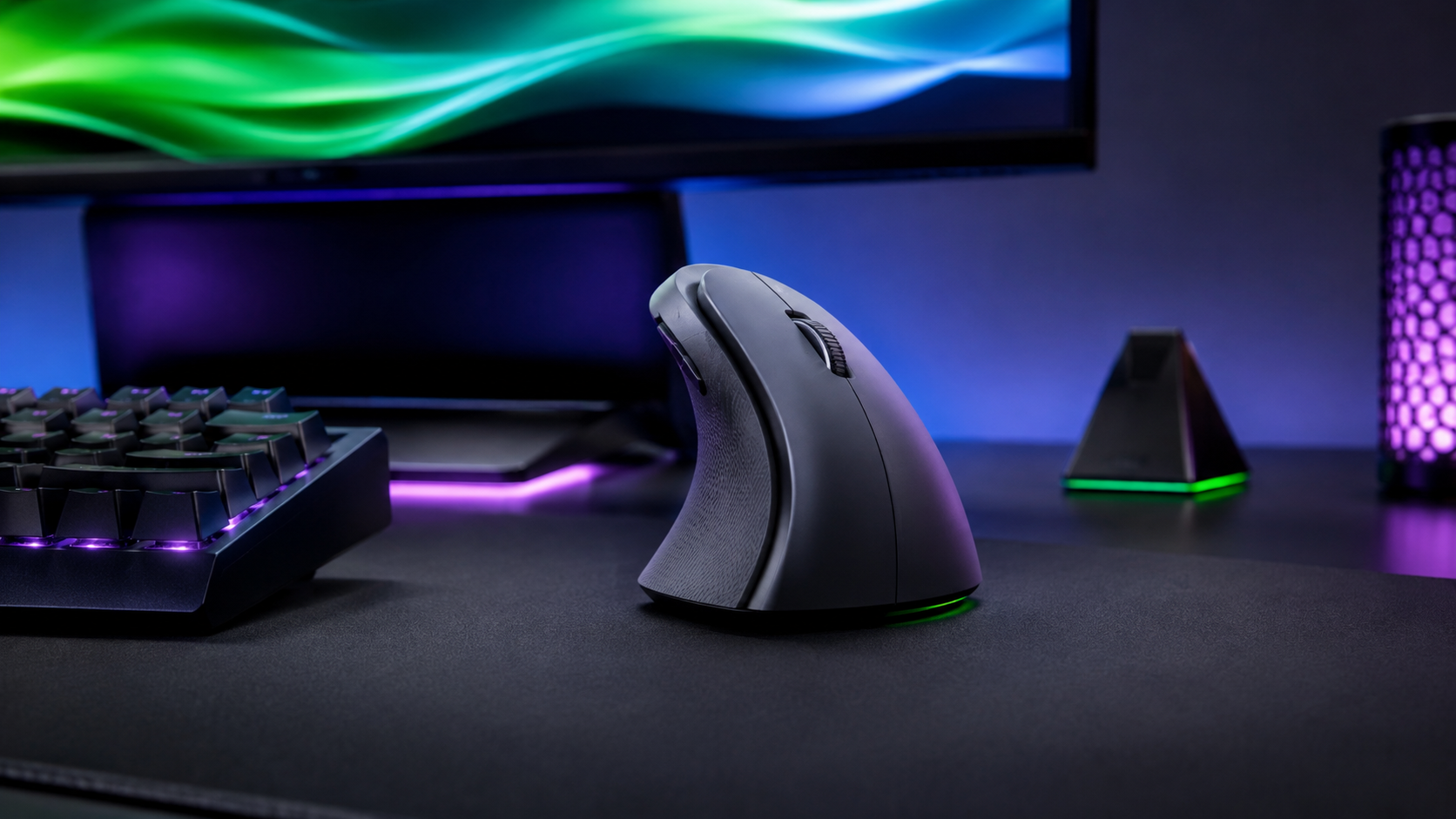 Black vertical mouse on a dark desk mat in an RGB-lit battlestation, with a split keyboard and purple accent lighting behind it, the gaming side of the best vertical mouse question