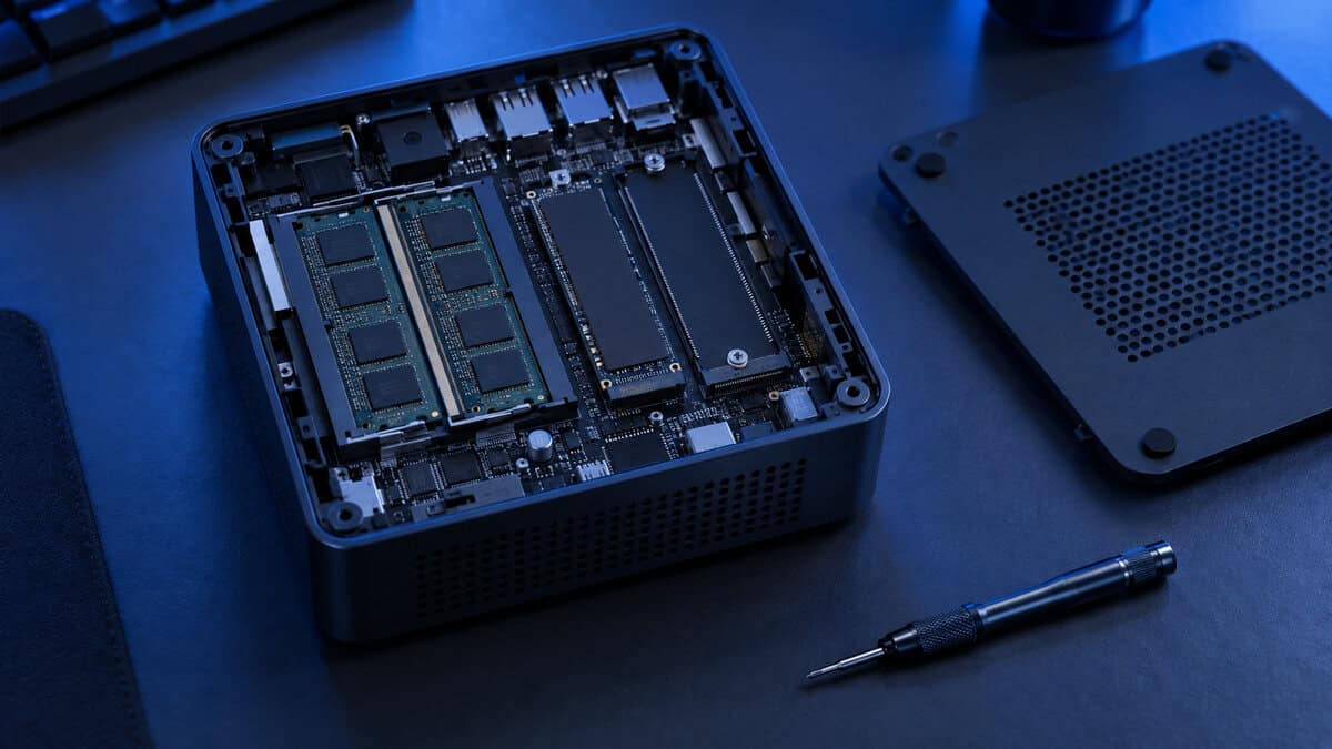 Open mini PC showing two memory sticks and two M.2 drives inside, the parts that matter most for mini pc gaming