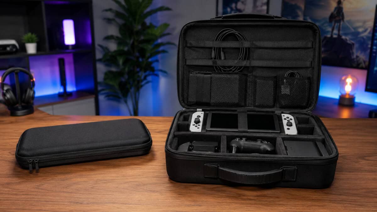 Slim shell and deluxe travel switch 2 case side by side on a wooden desk with the larger case standing open