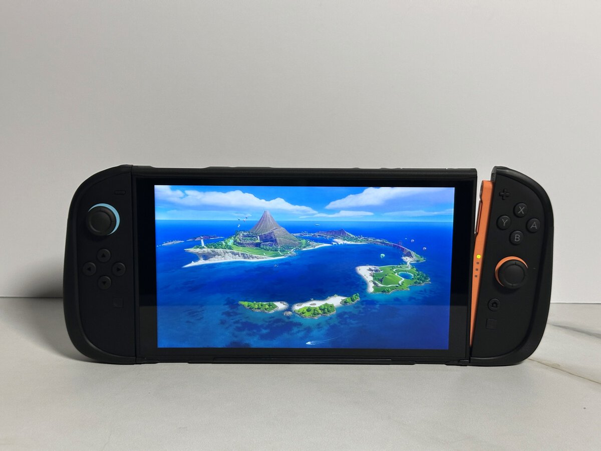 Right Joy-Con 2 with its JSAUX GoJoy case cover slid off the side of the Switch 2