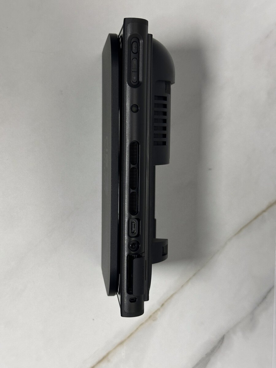 Top edge of a Switch 2 in the JSAUX GoJoy case showing the open ports, buttons and card slot