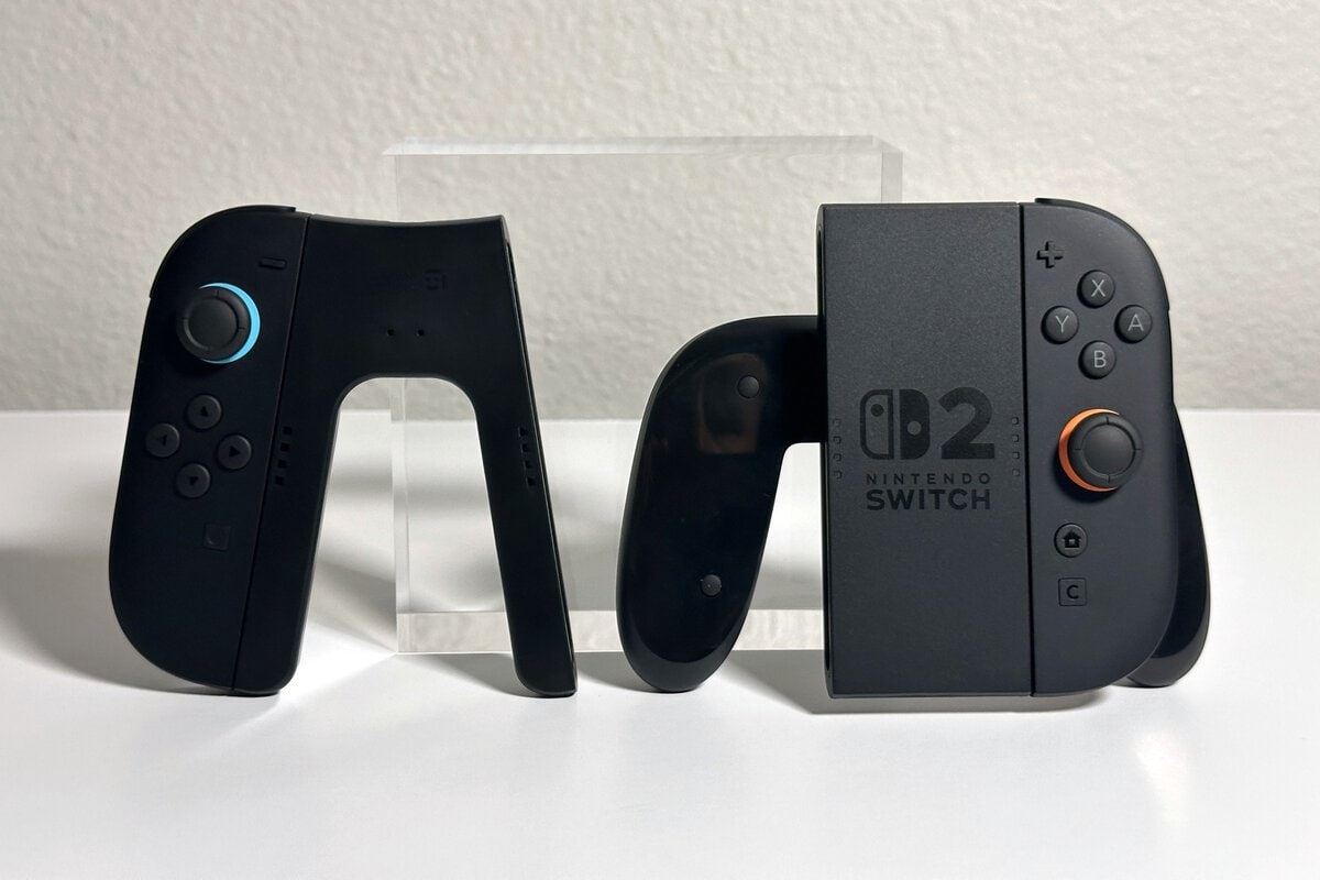 JSAUX Switch 2 charging grip next to the Nintendo grip that comes with the Switch 2, both holding Joy-Con 2